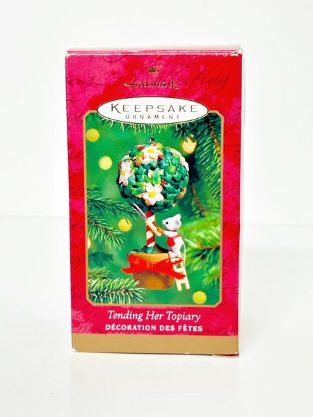 Perfect for ornament collectors: our Hallmark Keepsake Ornament "Tending Her Topiary" (2000) provides charming, detailed holiday decor. Shop today!