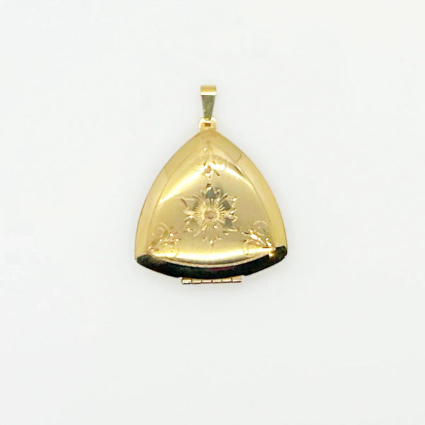 Showcase cherished memories in luxurious style with our Vintage Gold Filled Triangular Scrollwork Locket. With its exclusive triangular design and intricate floral engravings, it's an exquisite statement piece. 
