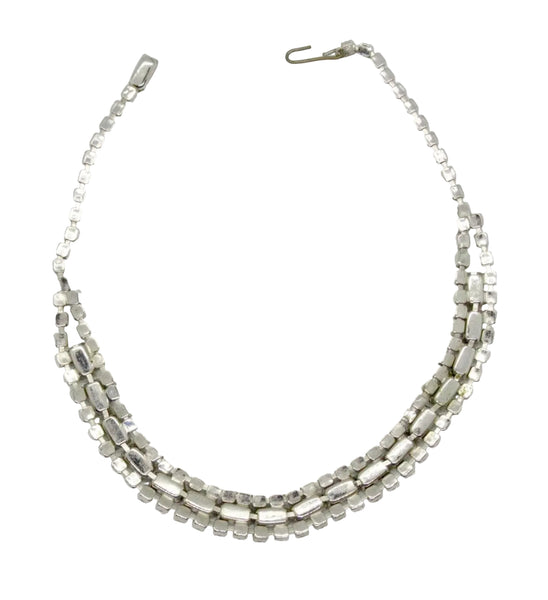 This is a beautiful vintage rhinestone necklace or choker set with a line of sideways baguettes in black paired with meticulously prong-set round white rhinestones on top and bottom.