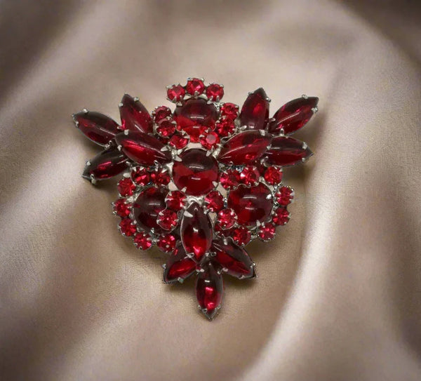 Absolutely gorgeous rich red cabochons in round and marquise shapes are accented with round rhinestones in a matching hue. It has multiple layers to catch the light, and each stone is prong set or double prong set to keep it wearable for decades.