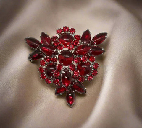 Absolutely gorgeous rich red cabochons in round and marquise shapes are accented with round rhinestones in a matching hue. It has multiple layers to catch the light, and each stone is prong set or double prong set to keep it wearable for decades.