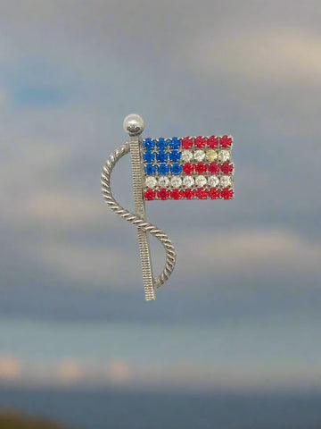 Make a bold statement of patriotism with the Vintage Sparkling American Flag Brooch, an elegant accessory designed to enhance any outfit. Its silver-toned finish and detailed craftsmanship beautifully embody the American flag, offering a sophisticated touch of national pride.