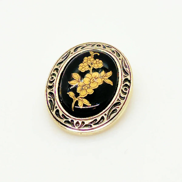 Boost your scarf game with this fabulous vintage oval scarf clip straight from W. Germany! This black and gold beauty isn't just a practical accessory—it's a conversation starter that adds a touch of retro glam to any outfit