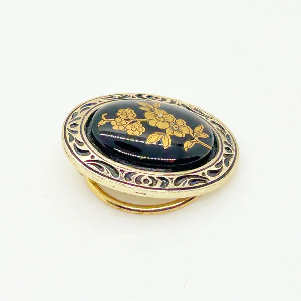Boost your scarf game with this fabulous vintage oval scarf clip straight from W. Germany! This black and gold beauty isn't just a practical accessory—it's a conversation starter that adds a touch of retro glam to any outfit