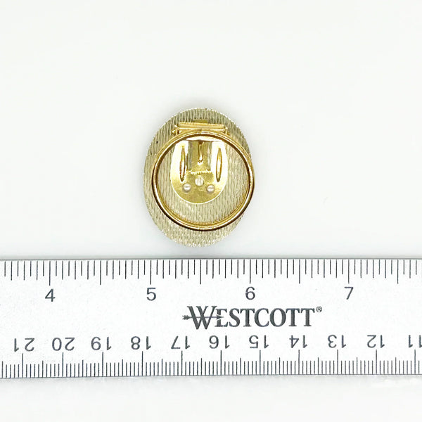 Boost your scarf game with this fabulous vintage oval scarf clip straight from W. Germany! This black and gold beauty isn't just a practical accessory—it's a conversation starter that adds a touch of retro glam to any outfit