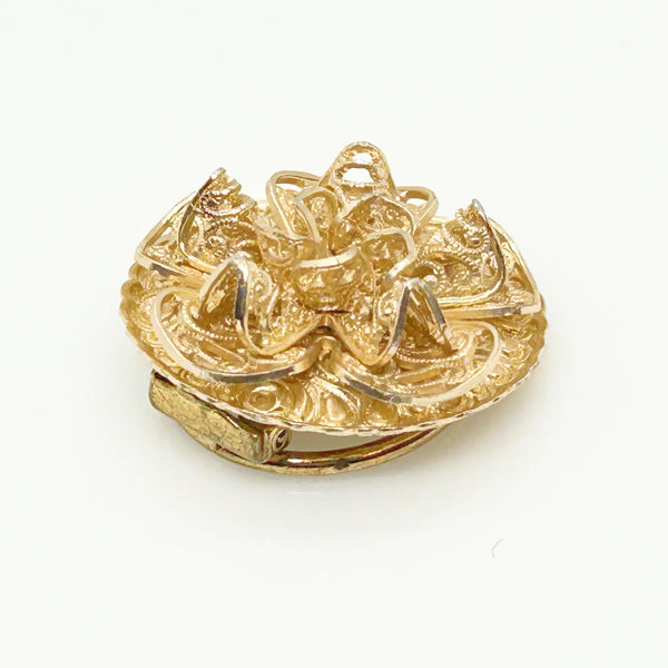 This exquisite scarf clip showcases delicate, finely crafted filigree work with layered, ruffled details resembling floral or ribbon motifs. Measuring 1.5" in length, it carries the distinguished signature of W. Germany, making it a unique and elegant accessory.