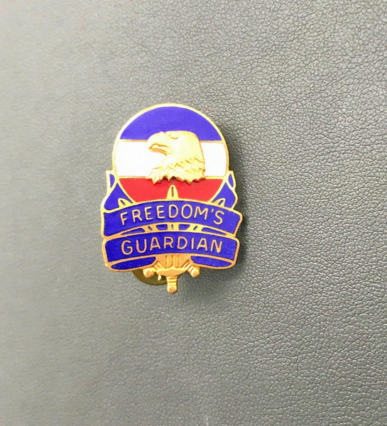 Vintage US Army FORSCOM Freedom's Guardian unit crest lapel pin featuring a gold-tone bald eagle against a red, white, and blue enameled background on a white backdrop