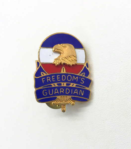 Vintage US Army FORSCOM Freedom's Guardian unit crest lapel pin featuring a gold-tone bald eagle against a red, white, and blue enameled background on a white backdrop