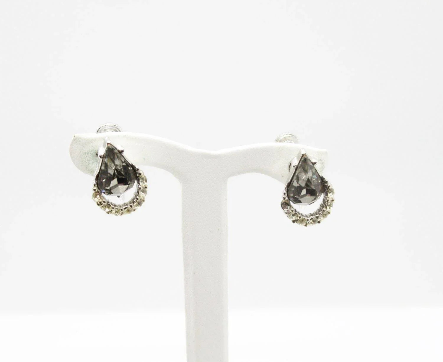 A pair of sparkling teardrop gray rhinestone earrings with clear round rhinestone accents, signed Weiss