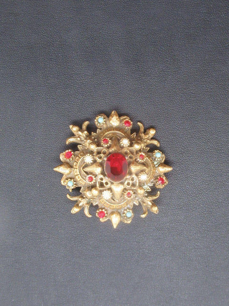 Vintage Ornate Brooch with Glittering Red Center - Lamoree’s Vintage